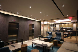 LED accent strip lights in a hotel lobby and café. Boca Lighting and Controls