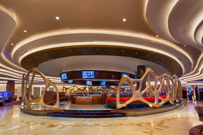 LED linear cove lighting in a casino accenting architectural elements in the ceiling, walls and highlighting architectural elements. Boca Lighting and Controls.