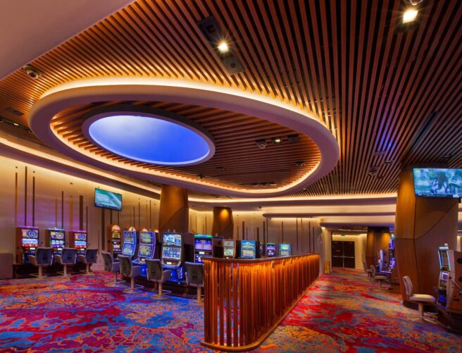 LED accent strip lights accent the ceiling, walls, and counters in a hotel casino.