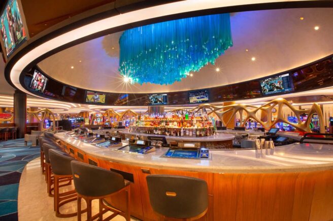 LED accent strip lights illuminate a casino bar.