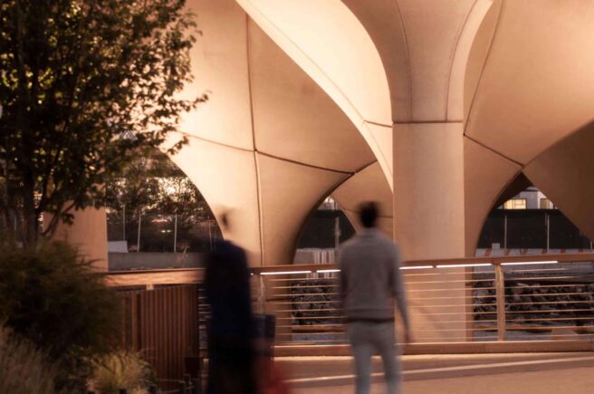 Boca Lighting and Controls wall washing fixtures illuminating modern architecture in an outdoor garden.