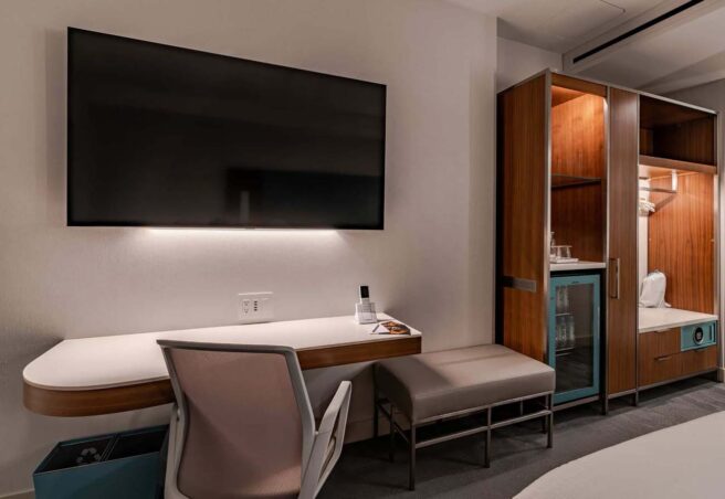 LED linear strip lighting and cove lighting highlight areas in this guestroom at the Luma Hotel.