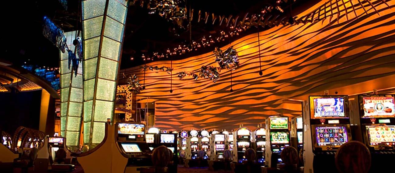 LED accent strip lights highlight walls and architectural elements inside of a casino.
