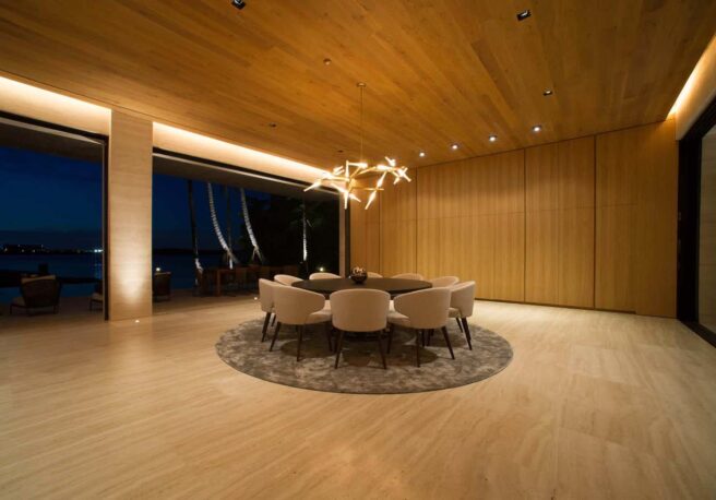LED cove lighting fixtures illuminate a modern residential dining room.