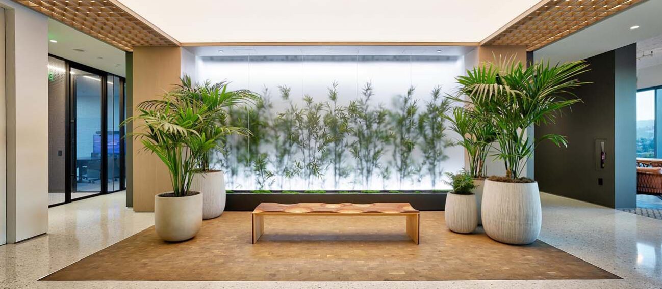 LED wall washing and façade lighting fixtures illuminate a commercial waiting area inside Westbridge Capital.