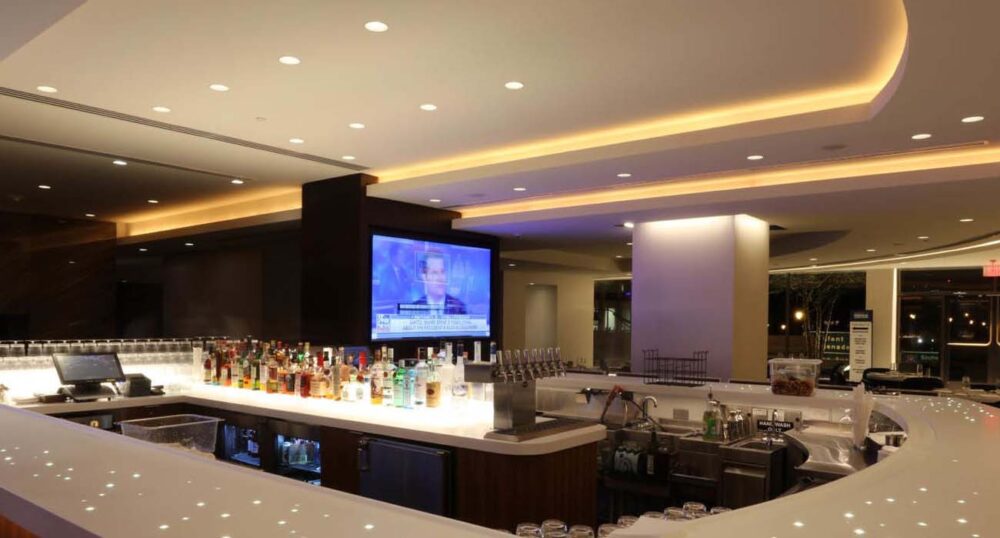 How does Dim-to-Warm Lighting Work? Warm cove lighting in a hotel bar