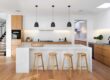 A kitchen counter illuminated by hidden task lighting