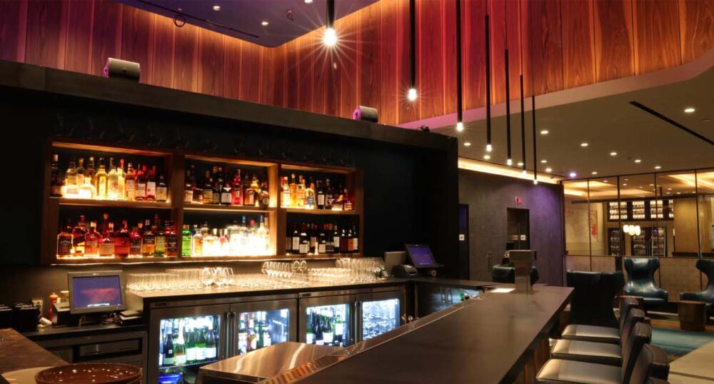 Create Stunning Visual Spaces with Wall Washing and Wall Grazing Light Wall washing LED lighting in a hotel bar