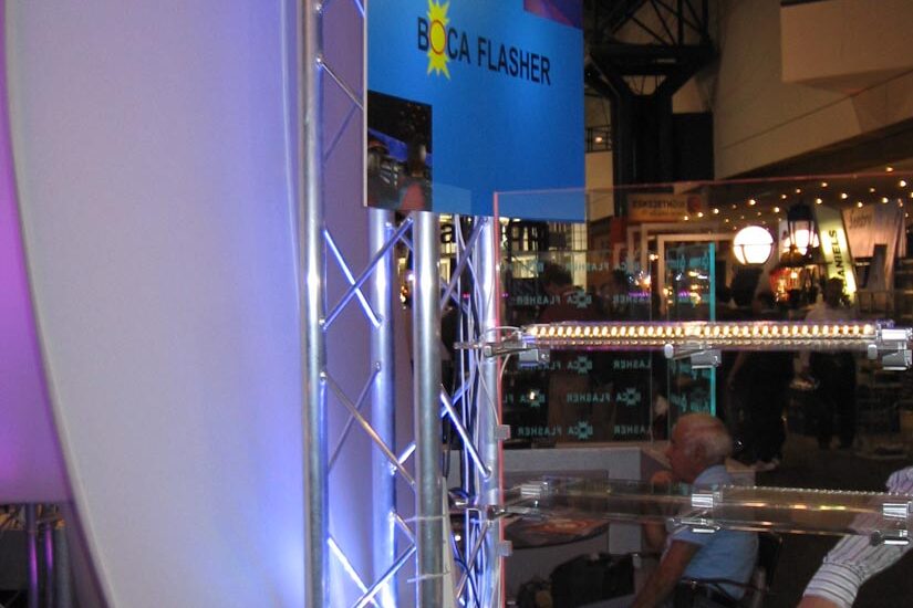 Boca Flasher products on display at a trade show booth