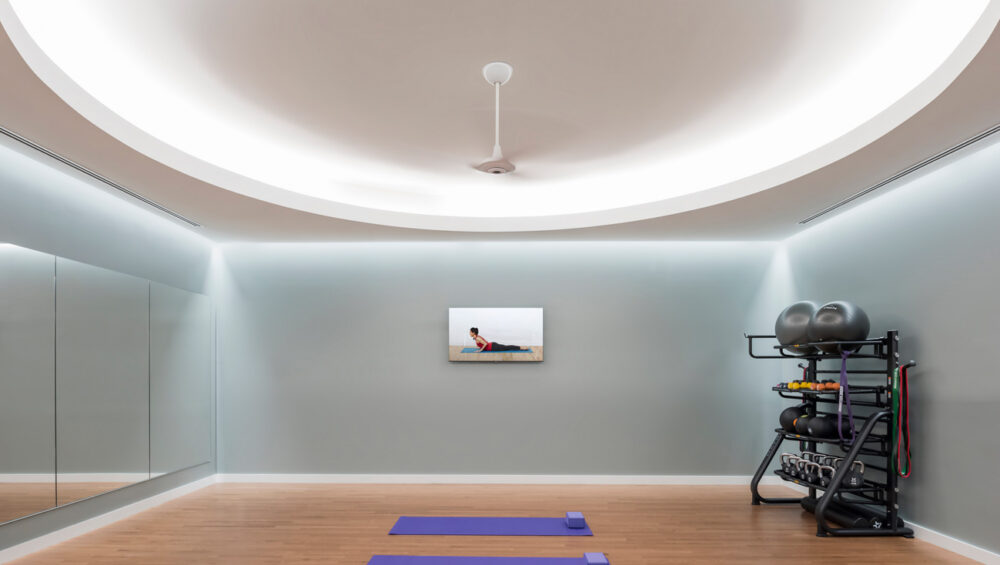 Continuous cove lighting installed in a gym ceiling