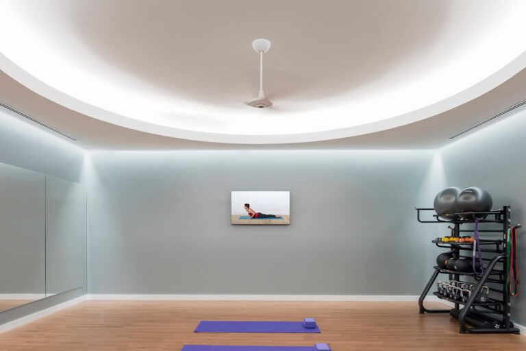 Continuous cove lighting installed in a gym ceiling